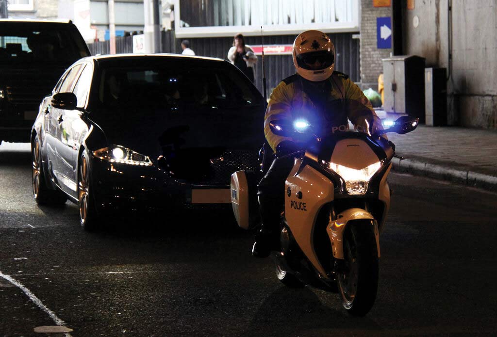 Jaguar XJL With Police Motorcycle Outrider Escort